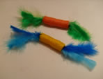 Cilindros con hilo de color, plumas y sonido x 6 unid